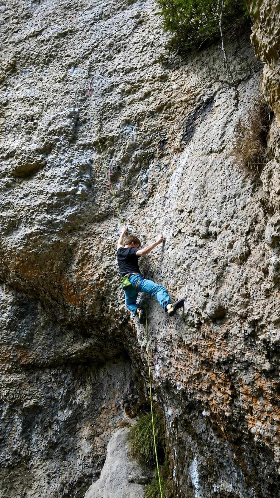 Redpointing a steep limestone sport route in the Frankenjura