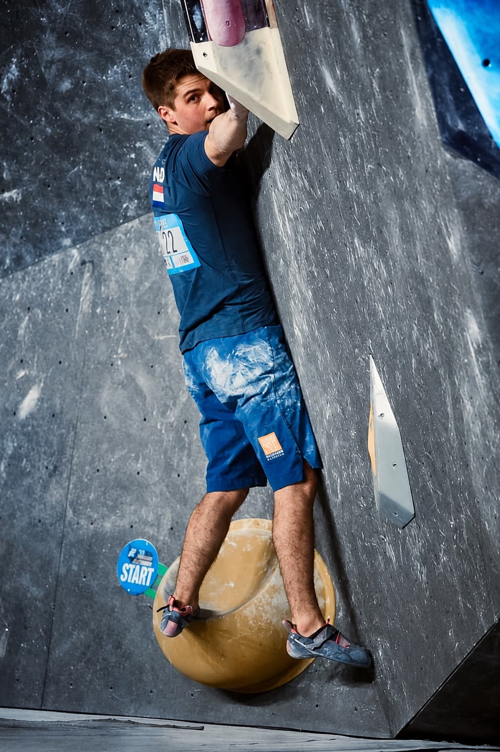 Climbing a bouldering World Cup problem at Meiringen