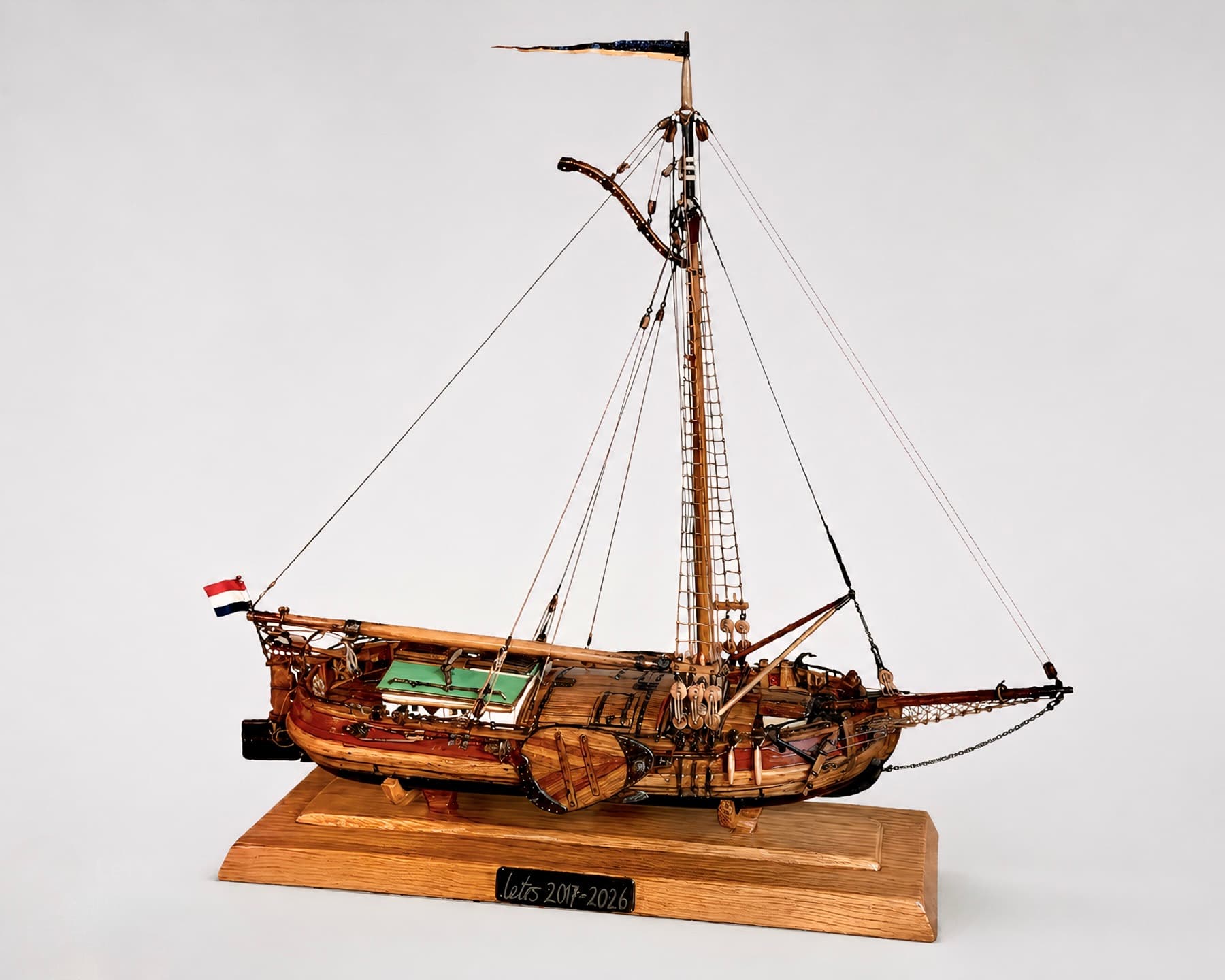 The finished, fully rigged and painted ship model with a Dutch flag